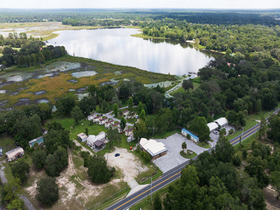 water, trees, road, buildings