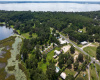 water, trees, road, buildings