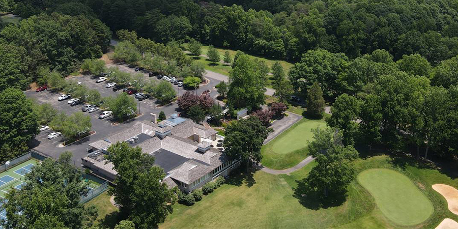 trees, building, parking lot, cars, golf course
