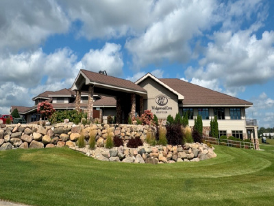 building, grass, sky, clouds