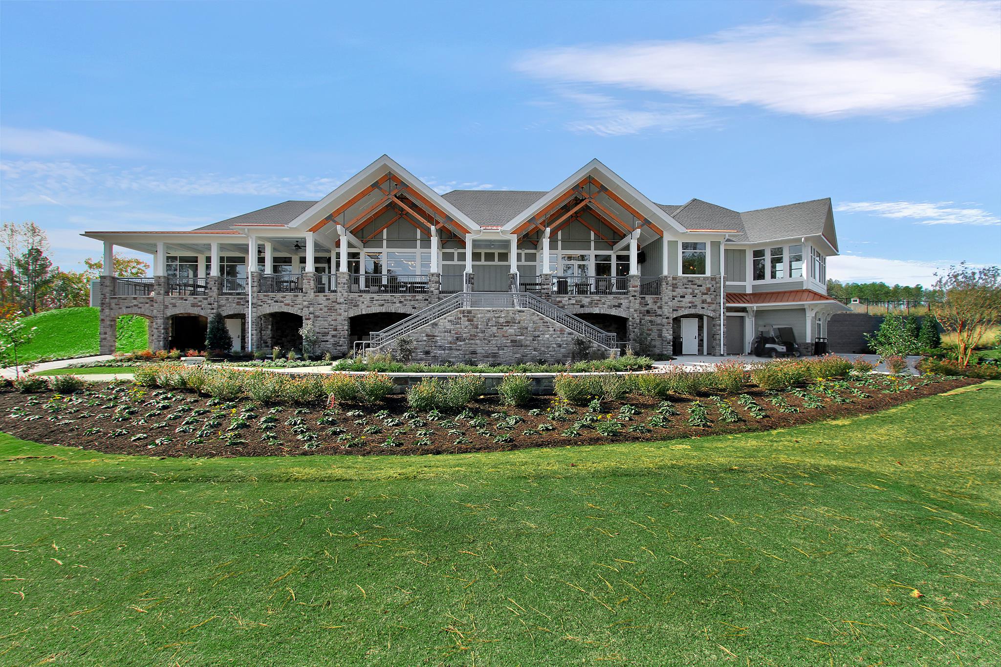 Clubhouse, trees, golf greens Clubhouse, trees, golf greens