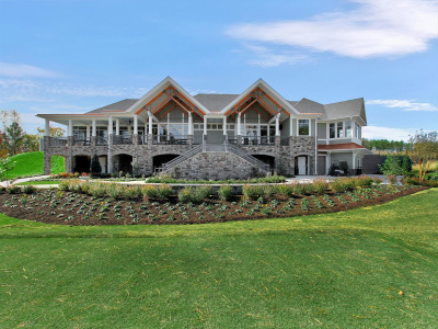 Clubhouse, trees, golf greens